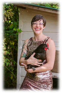 A person holding a chickenDescription automatically generated with medium confidence