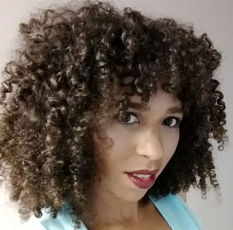 A person with curly hair

Description automatically generated