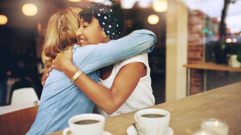 diverse-women-hugging-coffee-shop.jpg Thumbnail