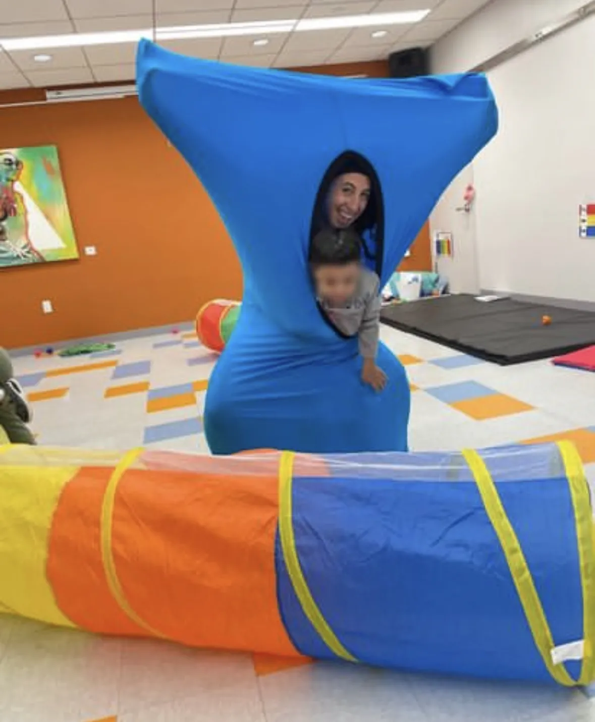 therapist and young person in body sock