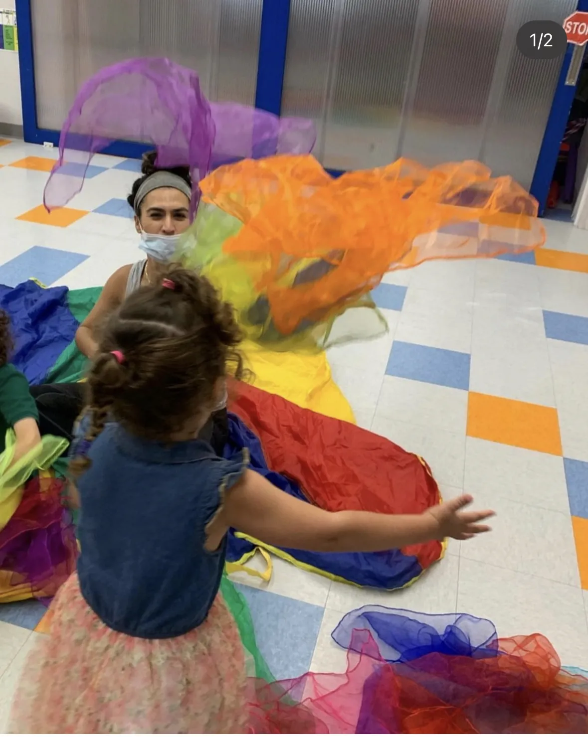 Therapist and young person playing with scarves